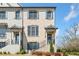 Charming townhome with a light brick facade, neat landscaping, and inviting front porch at 1949 Skyfall Cir, Brookhaven, GA 30319