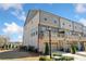 Spacious townhome with a ground floor garage, deck, and brick and siding exterior at 1949 Skyfall Cir, Brookhaven, GA 30319