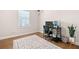 Neat office space with monitors, a desk, rolling chair and a decorative rug at 1949 Skyfall Cir, Brookhaven, GA 30319