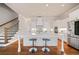 Bright, spacious kitchen featuring a large center island with seating, modern appliances, and hardwood floors at 1949 Skyfall Cir, Brookhaven, GA 30319