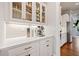 Kitchenette featuring white countertops, glass faced upper cabinets, and stainless appliances at 1949 Skyfall Cir, Brookhaven, GA 30319