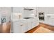 Updated kitchen featuring all-white cabinets, stainless steel appliances, and a gas cooktop at 1949 Skyfall Cir, Brookhaven, GA 30319