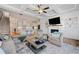 Open-concept living room with a fireplace, built-in shelves, and a view into the kitchen at 1949 Skyfall Cir, Brookhaven, GA 30319