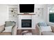 Inviting living room with a white brick fireplace, built-in shelving, and comfortable seating at 1949 Skyfall Cir, Brookhaven, GA 30319