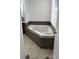 Bathroom featuring soaking tub with tile surround at 2520 Laurel Nw Cir, Atlanta, GA 30311