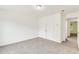 Bright bedroom with neutral carpet, white walls and a closet with double doors at 2520 Laurel Nw Cir, Atlanta, GA 30311