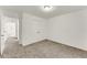 Bright bedroom with neutral carpet and white walls with access to hallway at 2520 Laurel Nw Cir, Atlanta, GA 30311