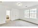 Bedroom with carpeted floors, large windows, and a closet at 2520 Laurel Nw Cir, Atlanta, GA 30311