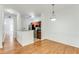 Dining area with hardwood floors, decorative molding and adjacent to a kitchen at 2520 Laurel Nw Cir, Atlanta, GA 30311