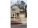 Traditional two-story home featuring tan siding and a single-car garage at 2520 Laurel Nw Cir, Atlanta, GA 30311