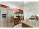 Modern kitchen with stainless steel appliances, granite countertops, and wood cabinets at 2520 Laurel Nw Cir, Atlanta, GA 30311
