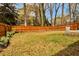 Lush backyard with a well-maintained lawn and a charming wooden fence, perfect for outdoor activities and relaxation at 5505 Longmeadow Ln, College Park, GA 30349