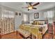 Inviting bedroom with warm tones, soft lighting, and a plush bed, creating a tranquil and restful atmosphere at 5505 Longmeadow Ln, College Park, GA 30349