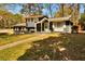 Traditional two-story home with a cozy front porch and neatly kept landscaping at 5505 Longmeadow Ln, College Park, GA 30349