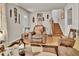 Cozy living room with a brown armchair, wooden floors, and staircase access at 5505 Longmeadow Ln, College Park, GA 30349