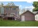 Backyard with a deck and stairs leading to the yard and detached garage at 109 Bowen Sw Cir, Atlanta, GA 30315