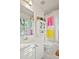 Bright bathroom with storage cabinet, large mirror, and bright light fixtures at 109 Bowen Sw Cir, Atlanta, GA 30315