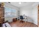 Cozy bedroom features hardwood floors, natural light, and built-in shelving at 109 Bowen Sw Cir, Atlanta, GA 30315