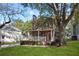 A charming two-story home with a spacious front yard and mature trees at 109 Bowen Sw Cir, Atlanta, GA 30315