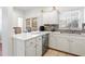 Bright, updated kitchen with stainless steel appliances, tile backsplash, and tiled floor at 109 Bowen Sw Cir, Atlanta, GA 30315