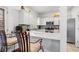 Updated kitchen features white cabinets, stainless steel appliances, granite countertops, and tiled floors at 109 Bowen Sw Cir, Atlanta, GA 30315