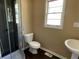 Modern bathroom features a glass shower, toilet, and sleek sink at 1271 Sanders Dr, Lake City, GA 30260