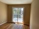 Bright bedroom offers hardwood floors and access to the backyard deck at 1271 Sanders Dr, Lake City, GA 30260