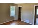 Cozy bedroom with hardwood floors, a closet, and a window providing ample natural light at 1271 Sanders Dr, Lake City, GA 30260