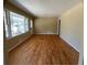 Spacious living room with hardwood floors and large windows offering natural light at 1271 Sanders Dr, Lake City, GA 30260