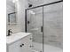 Modern bathroom features a glass-enclosed shower with sleek, black hardware and neutral tile at 1703 Derrill Dr, Decatur, GA 30032