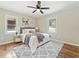 Cozy bedroom featuring a queen bed, plush rug, ceiling fan, and two windows for plenty of light at 1703 Derrill Dr, Decatur, GA 30032