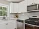 This kitchen has modern appliances and a stainless steel faucet at 1703 Derrill Dr, Decatur, GA 30032