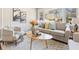 Bright living room featuring a comfortable sofa, accent chairs, and a patterned rug at 1703 Derrill Dr, Decatur, GA 30032