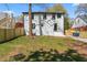 This lovely fenced backyard, perfect for entertaining, features a lush lawn and mature trees at 382 Deckner Sw Ave, Atlanta, GA 30310