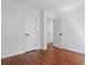 Spacious bedroom with hardwood floors, and multiple white doors at 382 Deckner Sw Ave, Atlanta, GA 30310