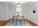 Cozy dining room with modern table set, decorative rug, and neutral decor at 382 Deckner Sw Ave, Atlanta, GA 30310