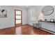 Bright entryway with wood floors, decorative front door, and stylish console table at 382 Deckner Sw Ave, Atlanta, GA 30310