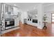 Bright kitchen with stainless appliances, white cabinets, and hardwood floors leading to living area at 382 Deckner Sw Ave, Atlanta, GA 30310