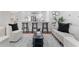 Open-concept living room and kitchen with modern decor, bar seating, and hardwood floors at 382 Deckner Sw Ave, Atlanta, GA 30310