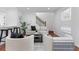 Elegant living room featuring hardwood floors, open space, and modern staircase at 382 Deckner Sw Ave, Atlanta, GA 30310