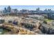 Aerial view showcases the property amidst a vibrant cityscape and lush greenery at 400 17Th Nw St # 1133, Atlanta, GA 30363