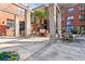 Outdoor courtyard with stone pillars, patio furniture, and a built-in barbecue grill at 400 17Th Nw St # 1133, Atlanta, GA 30363