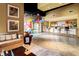 Welcoming lobby featuring a comfortable couch, tiled flooring, and decorative bar setup at 400 17Th Nw St # 1133, Atlanta, GA 30363