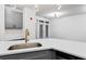 Modern kitchen featuring quartz countertops, stylish faucet and gray cabinetry at 400 17Th Nw St # 1133, Atlanta, GA 30363