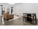 Modern living room with couch, chairs, table and doors to the outside at 400 17Th Nw St # 1133, Atlanta, GA 30363