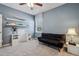 Bedroom with gray walls, white trim, carpet, ceiling fan, and floating shelves with display items at 4257 Freight St, Tucker, GA 30084