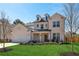 Beautiful two-story home with a well-manicured lawn and attached two car garage at 4257 Freight St, Tucker, GA 30084