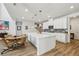 Spacious kitchen with a large island, stainless appliances, and adjacent dining space at 4257 Freight St, Tucker, GA 30084