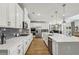 Stylish kitchen features a large island, stainless appliances, and elegant white cabinetry at 4257 Freight St, Tucker, GA 30084