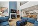Beautiful living room with fireplace, comfortable seating, and a view of the open kitchen and staircase at 4257 Freight St, Tucker, GA 30084